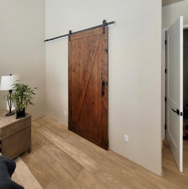 Custom barn door installation by Arizona Doors
